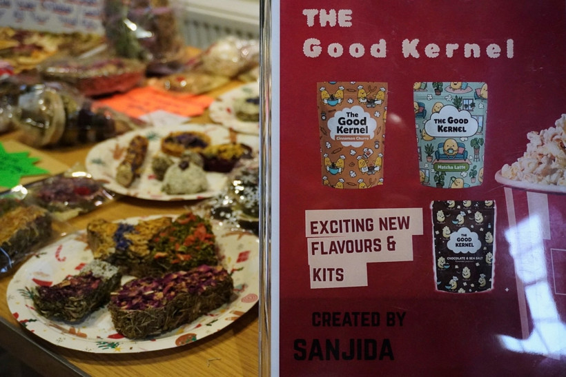 A poster display for The Good Kernel, one of the businesses developed during the programme, in front of Lilly's Little Paws' pet treat products.